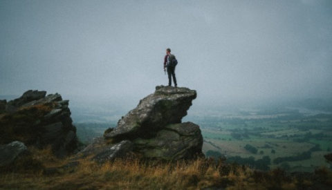 a man standing on The Roaches in the Peak District